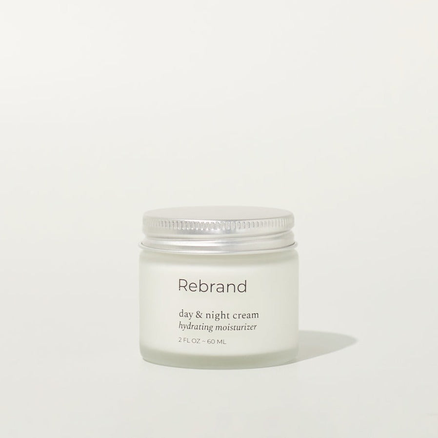 Day & Night Cream Hydrating Moisturizer in a glass jar and metal lid. 2 fl oz. earth friendly zero waste refillable eco conscious skincare