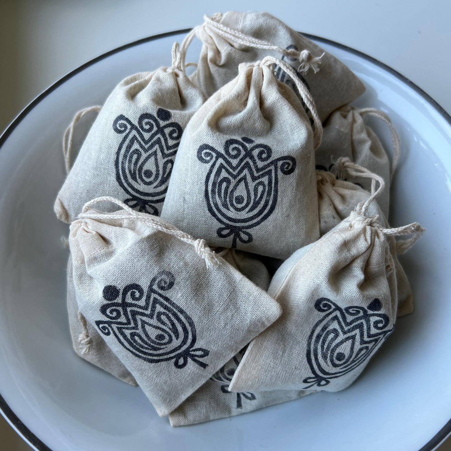 Natural cotton small sachets stamped with Rosebud Home Goods scandinavian rose logo. Filled with locally grown dried lavender flowers.