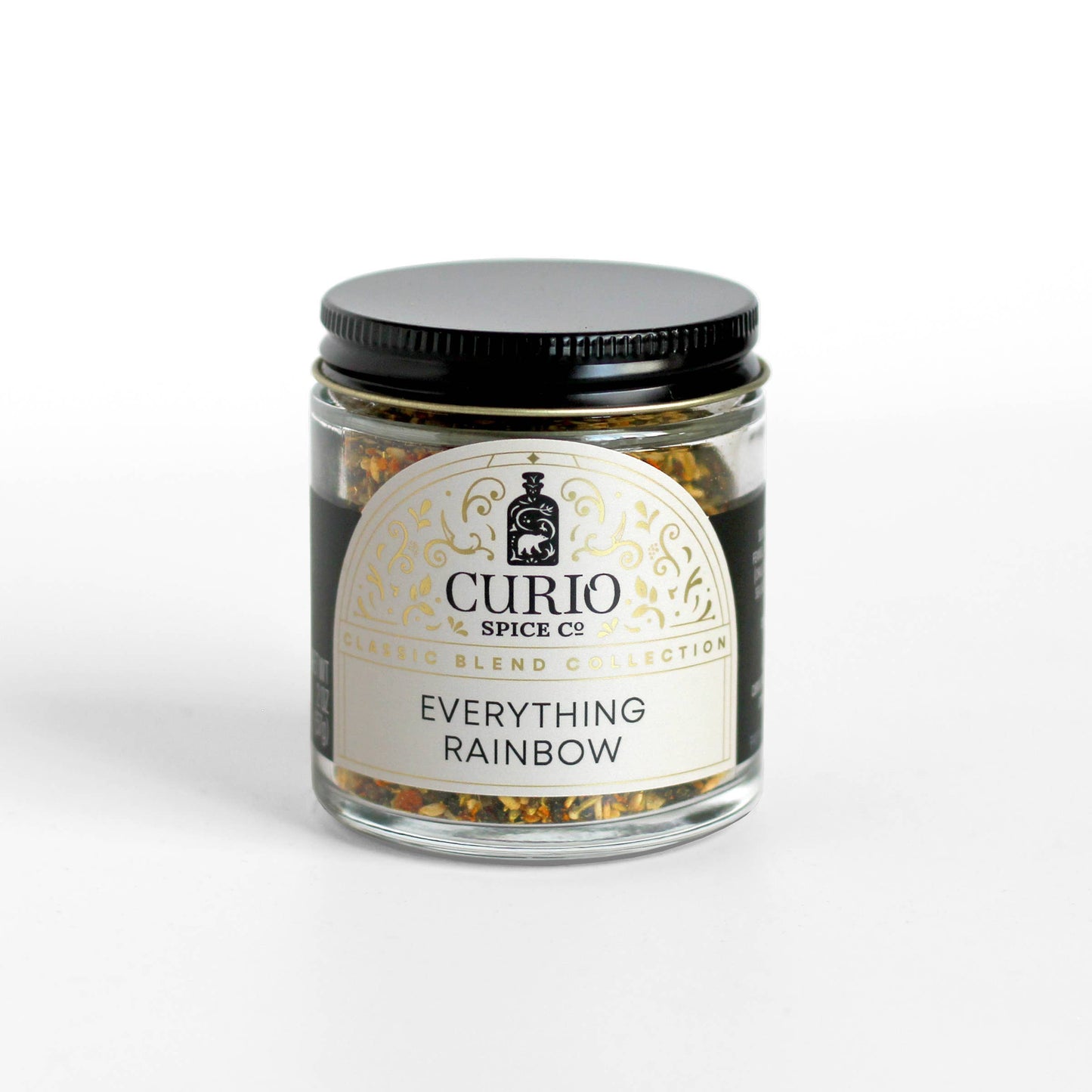 Colorful rainbow everything bagel seasoning by Curio Spice Co in a glass jar. Allium Free spice blend.