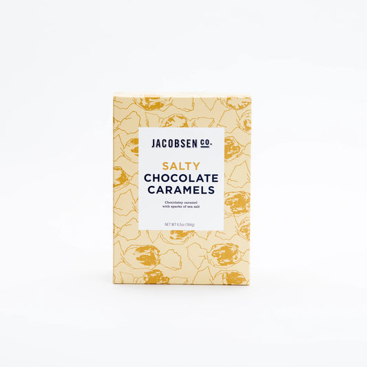 Golden yellow box full of salty chocolate caramel candy made with salt collected in Netarts Bay, Oregon USA