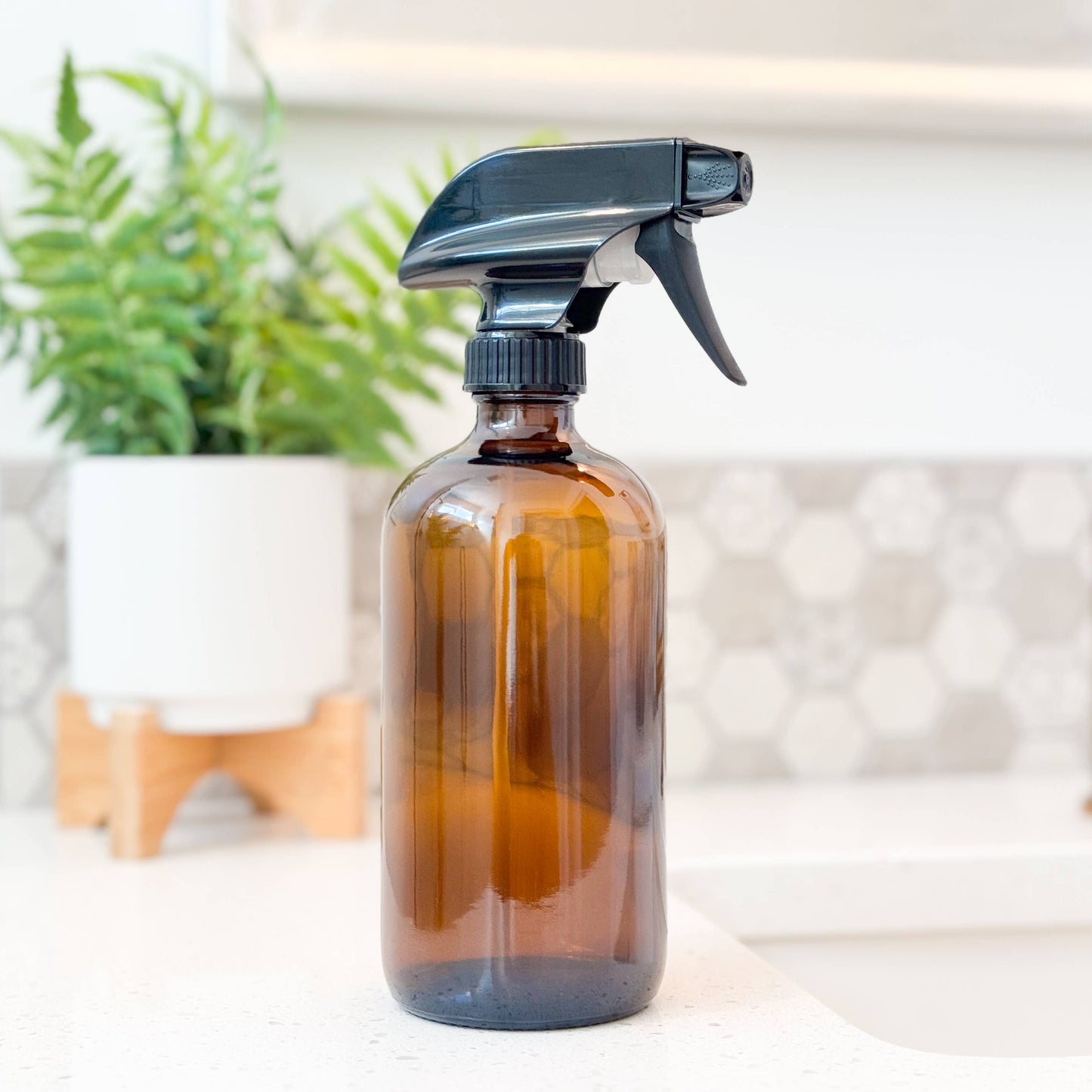 Amber colored 16 oz glass bottle with a black spray nozzle. Refillable and perfect for any zero waste home. 