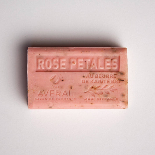 Pink bar of soap with exfoliating texture. Stamped with Rose Petales , au beurre de karite bio, made in france, averal savon de provence on the front. Gentle rose french bar of soap.