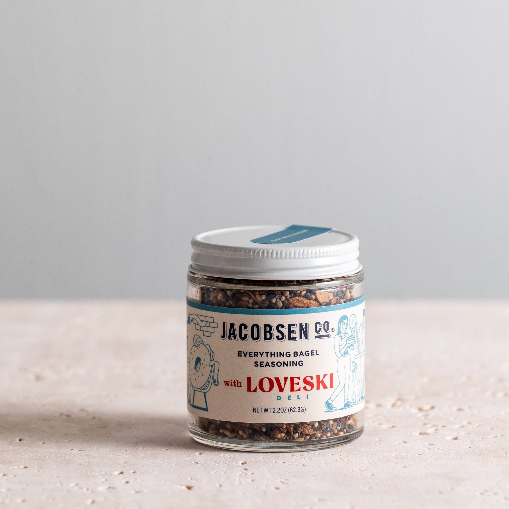 Everything bagel seasoning in a glass jar with  Jacobsen Co  branded label