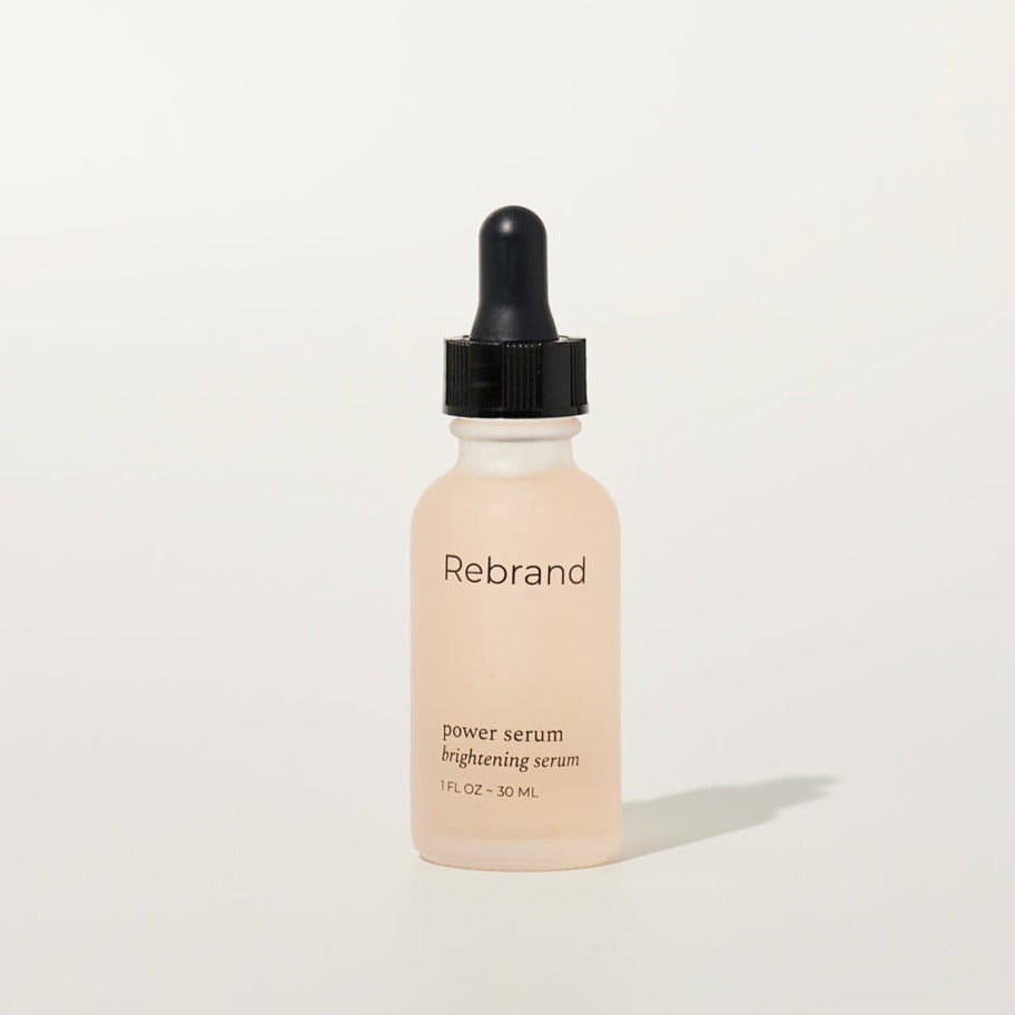 Power Serum by Rebrand skincare, brightening face serum in a frosted glass bottle with black dropper lid. 1 fl oz. earth friendly zero waste refillable eco conscious skincare