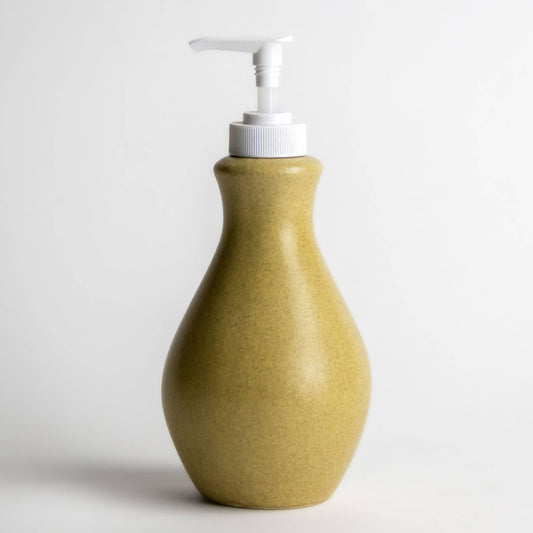 Stoneware refillable soap or lotion bottle with a white pump top. Speckled olive green color. Zero waste home. 