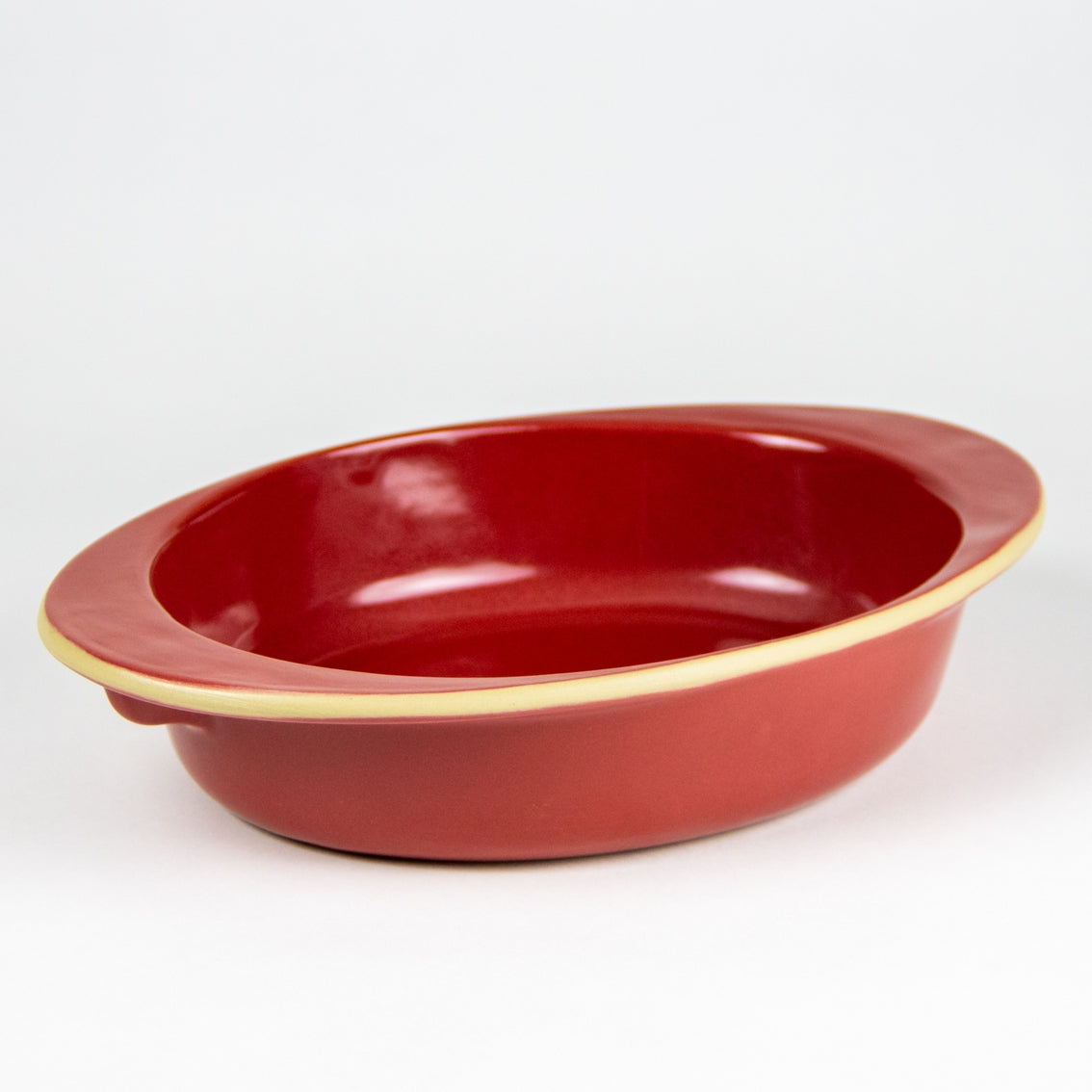 Vibrant red oval stoneware baking dish. Oven safe bakeware. 