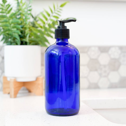 Cobalt blue glass 16 oz bottle with black pump. Perfect for lotions, soaps, refillable for zero waste homes