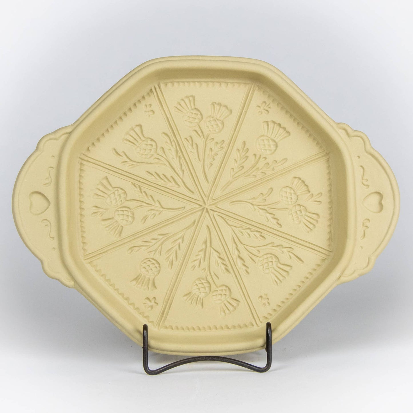 Thistle design round shortbread pan with handles embellished with hearts and swirls. Handmade bakeware. 